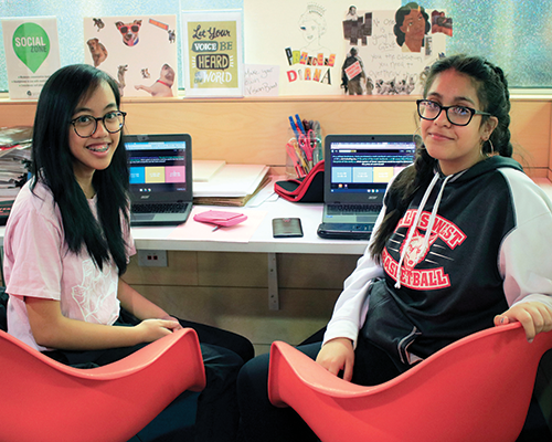 Teens working in computer room